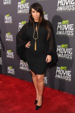 Kim K wore a black dress accessorized by a gold chain
